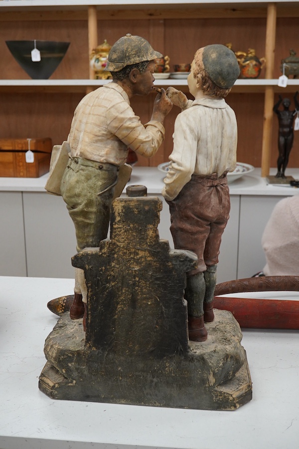 A late 19th century Johann Maresch figure group of two boys smoking. 55cm high. Condition - good